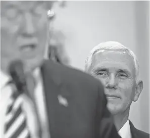  ??  ?? Vice President Mike Pence takes a back seat to President Trump during a White House event in May – playing the role of a dutiful vice president. EVAN VUCCI/AP