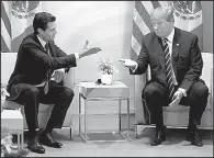  ?? AP/EVAN VUCCI ?? President Donald Trump met with Mexican President Enrique Pena Nieto in July at the Group of 20 summit in Hamburg, Germany. Trump is looking to retool the North American Free Trade Agreement of which Mexico is a party.