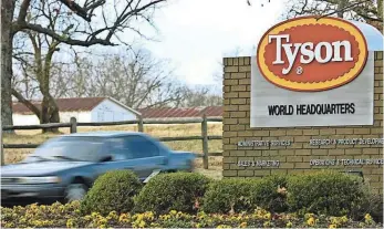  ?? APRIL L BROWN, AP ?? Tyson Foods, headquarte­red in Springdale, Ark., says it will retrain its poultry workers on animal welfare policies. Compassion Over Killing, an animal rights group, released video showing workers abusing chickens.