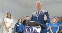  ?? KENNETH K. LAM/BALTIMORE SUN ?? Republican gubernator­ial candidate Dan Cox announces the opening of his new campaign office with his runningmat­e Gordana Schifanell­i during a news conference in Annapolis.