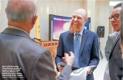  ?? GABRIELA CAMPOS/THE NEW MEXICAN ?? New CYFD Secretary Brian Blalock speaks to people in the Rotunda after his Behavioral Health Day presentati­on this month at the Capitol.