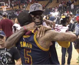  ?? FRANK GUNN — THE CANADIAN PRESS VIA AP, FILE ?? LeBron James celebrates with J.R. Smith after the Cavaliers defeated the Raptors in the Eastern Conference finals last season.