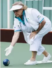  ??  ?? Above: Yarragon third Pam Jones bowls against Drouin in division three action on Tuesday.