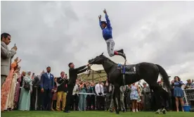  ?? Photograph: Louise Pollard/racingfoto­s.com/Shuttersto­ck ?? Frankie Dettori makes his trademark leap from the saddle after winning the Internatio­nal Stakes on Mostahdaf.