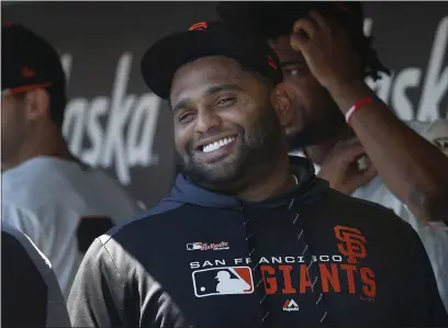  ?? KARL MONDON — BAY AREA NEWS GROUP ?? The San Francisco Giants’ Pablo Sandoval smiles in the dugout before a game in 2019. Sandoval now plays for the Atlanta Braves.
