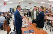  ?? OKLAHOMAN] [PHOTO BY CHRIS CASTEEL, THE ?? Republican gubernator­ial candidate Kevin Stitt, left, and his son, Drew, talk to Lt. Gov. Todd Lamb, right, before a GOP forum Saturday in Crowder.