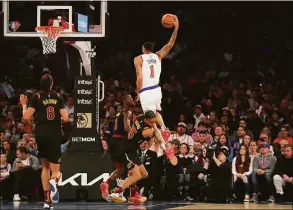  ?? Jim McIsaac / Getty Images ?? The Knicks’ Obi Toppin goes to the hoop during the second quarter and draws a foul against Isaac Okoro of the Cleveland Cavaliers at Madison Square Garden on Saturday.