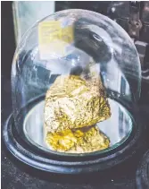  ??  ?? PRECIOUS: A gold-gilded, fist-size meteorite at Justin Brice Guariglia’s studio in New York.