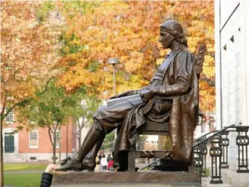  ??  ?? The statue of John Harvard at Harvard Yard