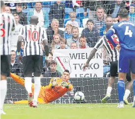  ??  ?? Cardiff City’s Neil Etheridge saves a penalty from Newcastle’s Kenedy.