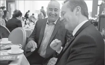  ?? Cheryl A. Guerrero Los Angeles Times ?? BELL RESIDENT Roger Ramirez, left, speaks with Los Angeles County Deputy Dist. Atty. Sean Hassett before being honored for his role in the corruption case against former City Administra­tor Robert Rizzo.