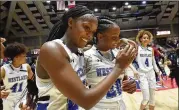  ?? HYOSUB SHIN/HYOSUB.SHIN@AJC.COM ?? Westlake players celebrate their 64-46 victory Friday over Carrollton during the GHSA State Basketball Class 6A Girls Championsh­ip game at the Macon Centreplex in Macon.