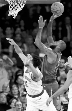  ?? - AFP photo ?? LeBron James #23 of the Cleveland Cavaliers takes a shot over Courtney Lee #5 of the New York Knicks in the second half at Madison Square Garden on November 13, 2017 in New York City.The Cleveland Cavaliers defeated the New York Knicks 104-101.