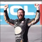  ?? Christian Petersen / Getty Images ?? Martin Truex Jr. celebrates after winning the Instacart 500 on Sunday.