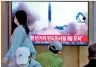  ?? ?? People watch a TV screen showing a news programme reporting about North Korea’s missile launch (HT)