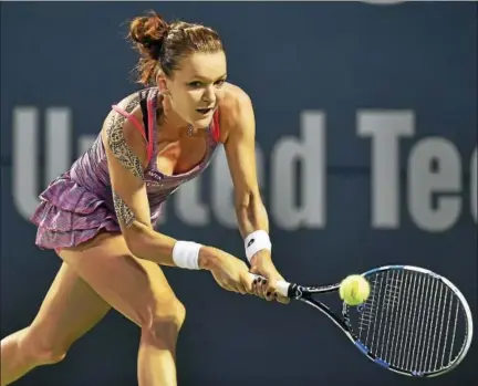  ?? CATHERINE AVALONE — REGISTER ?? Agnieszka Radwanska defeated two-time defending Connecticu­t Open champion Petra Kvitova 6-1, 6-1 in the semifinals on Friday night.