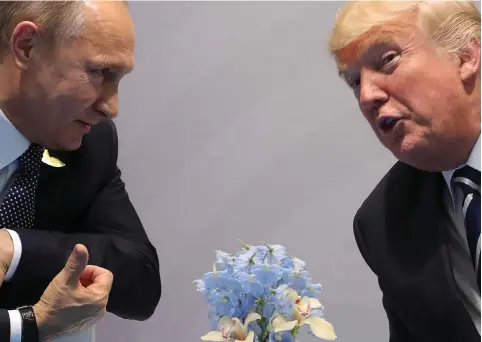  ?? (Mikhail Klimentyev/Russian Presidenti­al Press and Informatio­n Office/TASS/Abaca Press/TNS) ?? RUSSIAN PRESIDENT Vladimir Putin and US President Donald Trump talk during a bilateral meeting on the sidelines of the G-20 summit in Hamburg.