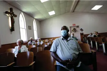  ?? Associated Press ?? Milton L. McDaniel Sr. attends a service at Boskydell Baptist Church Aug. 2 in Carbondale, Ill. McDaniel spent decades working as a railroad engineer in southern Illinois. He says as the only Black man on a full crew, he was often discrimina­ted against, being turned away from restaurant­s in some towns known as “sundown towns,” while his white coworkers were served.