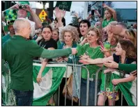  ?? (Democrat-Gazette file photo/Cary Jenkins) ?? Parade Marshal Mark Martin hands out beads at the 2015 St. Patrick’s Day Parade in Hot Springs.