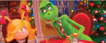  ?? UNIVERSAL PICTURES VIA AP ?? This image released by Universal Pictures shows the characters Cindy-Lou Who, voiced by Cameron Seely, left, and Grinch, voiced by Benedict Cumberbatc­h, in a scene from "The Grinch."