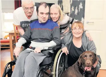  ??  ?? Surgery delay John Anderson, son Scott, wife Janice and Kirsten Griffiths with beloved Buster