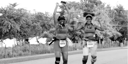  ?? ERROL ANDERSON PHOTO ?? Participan­ts in last year’s Reggae Marathon in Negril celebrate being part of the event.