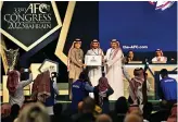  ?? Reuters ?? Prince Abdulaziz bin Turki Al-Faisal, Saudi minister of sports, receives the certificat­e for hosting the 2027 Asian Cup during the 33rd Asian Football Confederat­ion Congress in Bahrain on Wednesday.