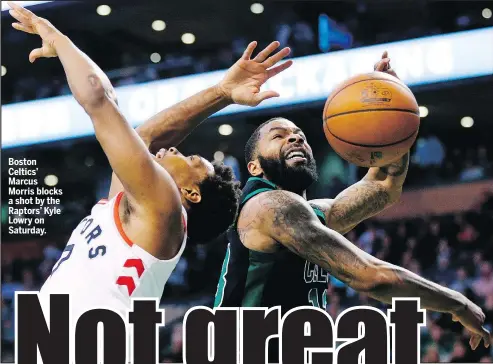  ?? MICHAEL DWYER/AP ?? Boston Celtics’ Marcus Morris blocks a shot by the Raptors’ Kyle Lowry on Saturday.