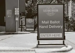  ?? Jay Janner / Austin American-Statesman ?? A sign indicates a drive-thru ballot drop-off location in Austin shortly after an order was announced by Gov. Greg Abbott restrictin­g such drop-off locations.