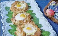  ?? [PHOTO BY SARA MOULTON/AP] ?? Eggs baked in pastry nests made of phyllo are ideal for your Easter feast.