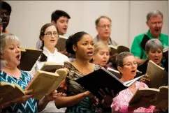  ?? Staff photo by Joshua Boucher ?? ■ Soloist Candice Taylor, center, and the Texarkana Regional Chorale rehearse Handel's Messiah in preparatio­n for their performanc­e on Sunday at Sacred Heart Catholic Church.