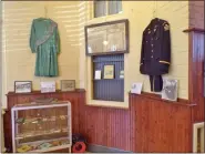  ?? BOB KEELER — MEDIANEWS GROUP ?? Uniforms are seen on display at the Perkasie Historical Society Museum’s “Perkasie 140th Anniversar­y: Clubs and Organizati­ons” exhibit.