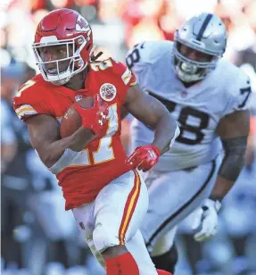  ??  ?? Rookie running back Kareem Hunt broke free for 138 yards from scrimmage and a touchdown in the Chiefs’ win Sunday.