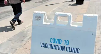  ?? BARRY GRAY THE HAMILTON SPECTATOR FILE PHOTO ?? The hockey hub model for COVID-19 vaccinatio­ns sees the client sit in one chair and have staff and volunteers complete registrati­on, medical screening, vaccinatio­n and observatio­n time all in the same place.