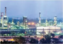  ?? — Bloomberg file picture ?? ROBUST GROWTH: Net income for the operator of the world’s biggest oil-refining complex rose to Rs80.2 billion ($1.2 billion) in the three months ended on December 31, the most since the December quarter of 2007.