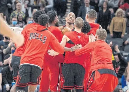  ?? ?? MAN OF THE MOMENT: Bulls forward DeMar DeRozan, centre, celebrates his game-winning basket at the buzzer against the Pacers with teammates.