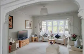  ??  ?? LET THERE BE LIGHT: A vast bay window makes this sitting room a delight