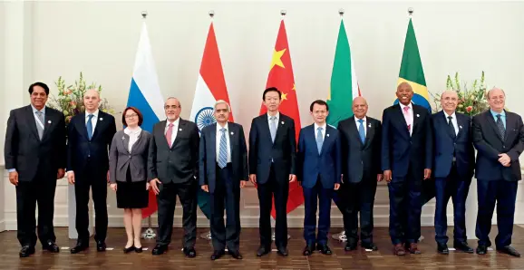  ??  ?? Representa­tives pose for a group photo during the first BRICS Finance Ministers and Central Bank Governors Meeting in Badenbaden, Germany on March 17, 2017.