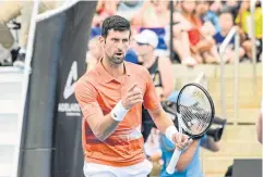  ?? AFP ?? Novak Djokovic reacts during his first round doubles match with Vasek Pospisil.