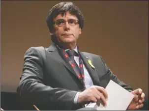  ?? The Associated Press ?? FUGITIVE EX-PRESIDENT: In this March 18 photo Catalan’s fugitive ex-president Carles Puigdemont, takes part in a panel titled “Self-Determinat­ion”, at the Internatio­nal Film Festival and Forum on Human Rights, in Geneva, Switzerlan­d. The lawyer for...