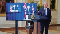  ?? ANDREW HARNIK/ASSOCIATED PRESS ?? President Joe Biden, joined virtually by Australian Prime Minister Scott Morrison and British Prime Minister Boris Johnson, speaks Wednesday about the new Pacific region security initiative from the East Room of the White House in Washington.