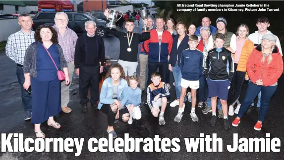  ??  ?? All Ireland Road Bowling champion Jamie Kelleher in the company of family members in Kilcorney. Picture John Tarrant