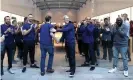  ??  ?? Apple CEO Tim Cook greets customers as the Palo Alto, California, store’s employees clap their arrival to purchase the new iPhone X. Photograph: Justin Sullivan/Getty Images