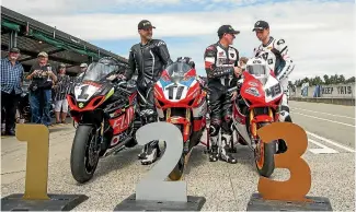  ?? PHOTO: JOSEPH JOHNSON/FAIRFAX NZ ?? Sloan Frost in a familiar position after the New Zealand Superbikes Grand Prix at Mike Pero Motorsport Park outside of Christchur­ch with Tony Rees and Alastair Hoogenboez­em.