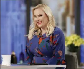  ?? LOU ROCCO — ABC VIA ASSOCIATED PRESS ?? Meghan McCain smiles on the set of “The View” in New York. McCain brings a feisty spirit to the conservati­ve commentato­r role where predecesso­rs frequently seemed overmatche­d and overlooked. She often reflects the views of President Trump’s supporters at a table and city where they are deeply unpopular.