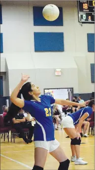  ?? Westside Eagle Observer/MIKE ECKELS ?? Lady Bulldog Stephanie Sandoval keeps her eye on the ball as she gets ready to serve to the Lady Warrior side of the court Sept. 1 during the Life Way-Decatur varsity volleyball match at First Baptist Church of Centerton Sept. 1. Life Way Christian defeated Decatur in three straight sets to take the match.