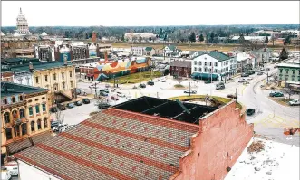  ?? LISA POWELL / STAFF 2020 ?? The building that houses The Caroline restaurant at 5 S. Market St. on Troy’s town square lost its roof top in a tornado a year ago. More constructi­on is underway or coming with renovation plans for other buildings in the historic district.