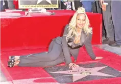  ??  ?? Blige is honoured with a star on The Hollywood Walk of Fame on Thursday. — AFP photo