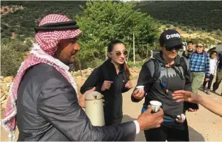  ?? Andrew Evans/Chicago Tribune/TNS ?? A Jordanian host welcomes his hiker guests with a traditiona­l cup of Arabic coffee, spiced with cardamom.