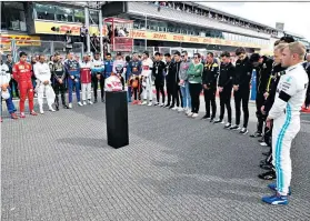  ??  ?? Poignant day: Charles Leclerc dedicates his win to Anthoine Hubert (right); the drivers pay tribute (above); Hubert’s brother and mother (below) with his helmet and consoled by Lewis Hamilton (right centre); the mangled car (top right) and a board of remembranc­e which fans signed (bottom right)